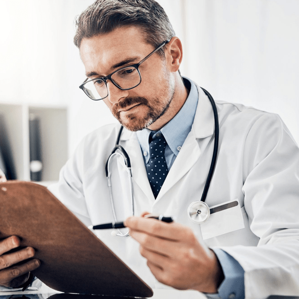 Doctor looking at a patient's chart